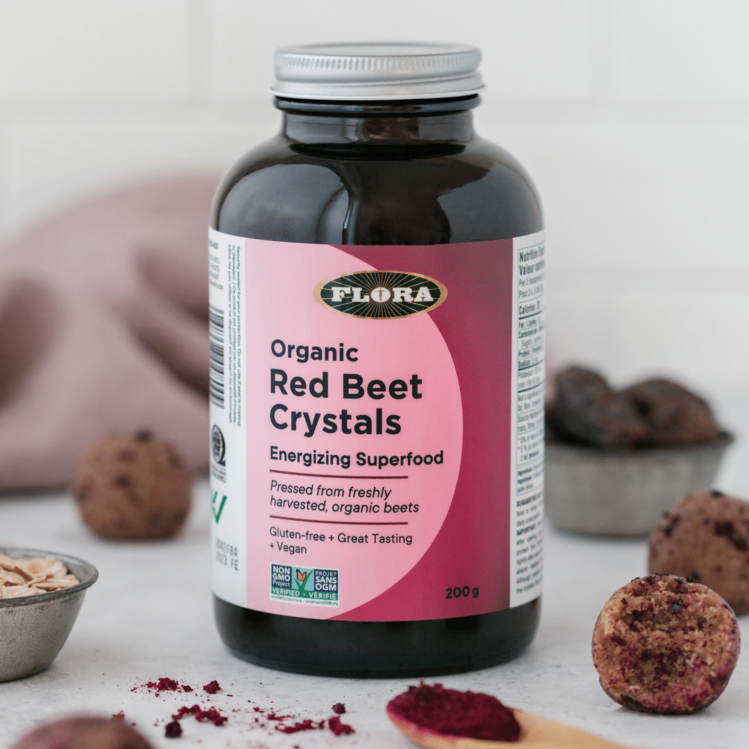 Flora organic red beet crystals energizing superfood on a table right next to some ingredients